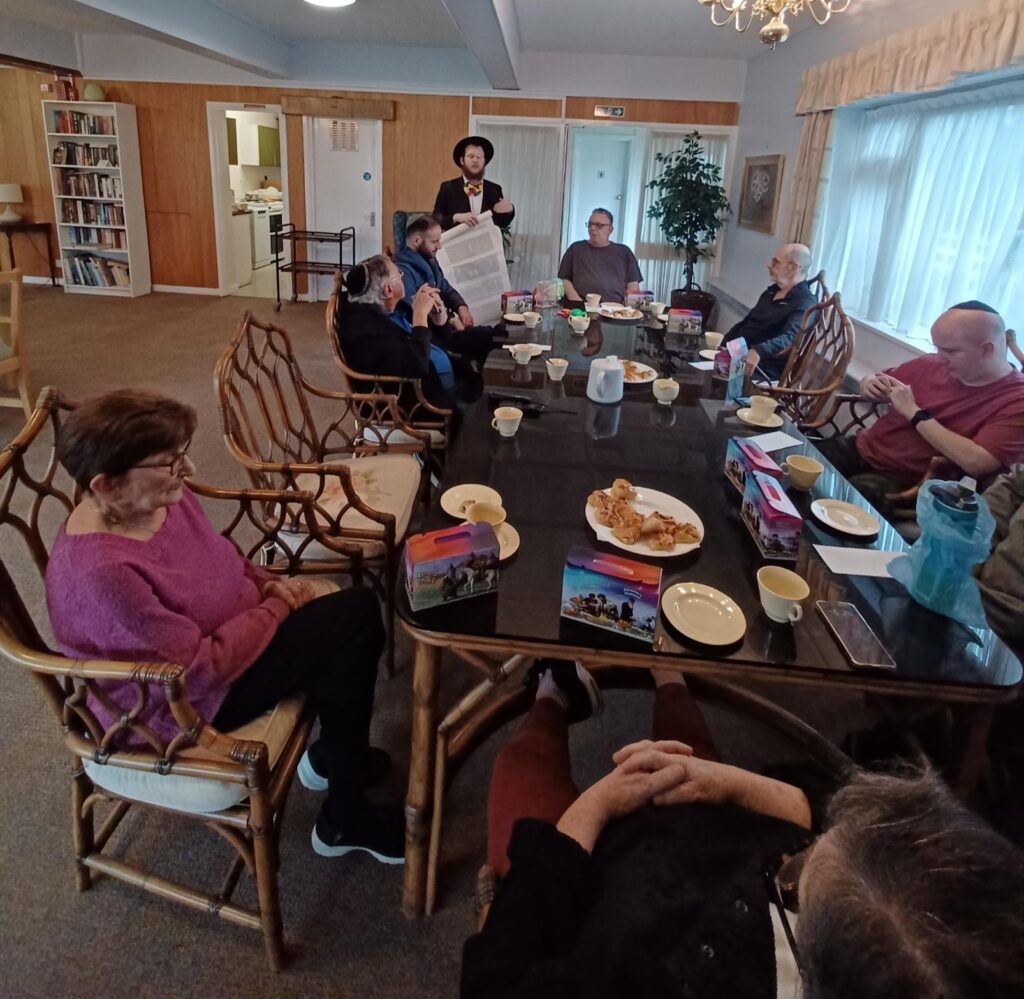 Tenants Celebrate Purim with Special Visit from Local Rabbi